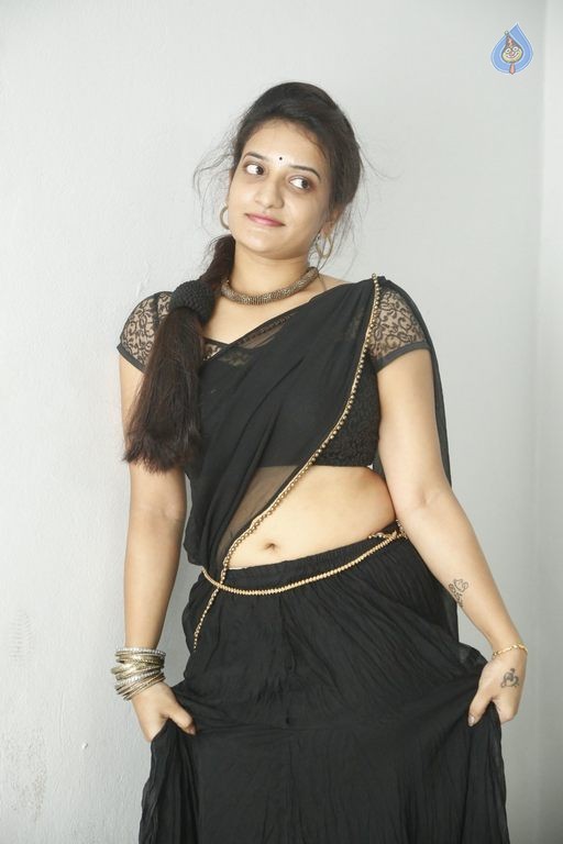 Actress Janani Reddy Hot Sexy Navel Show In Black Transparent Saree Photoshoot Stills 01