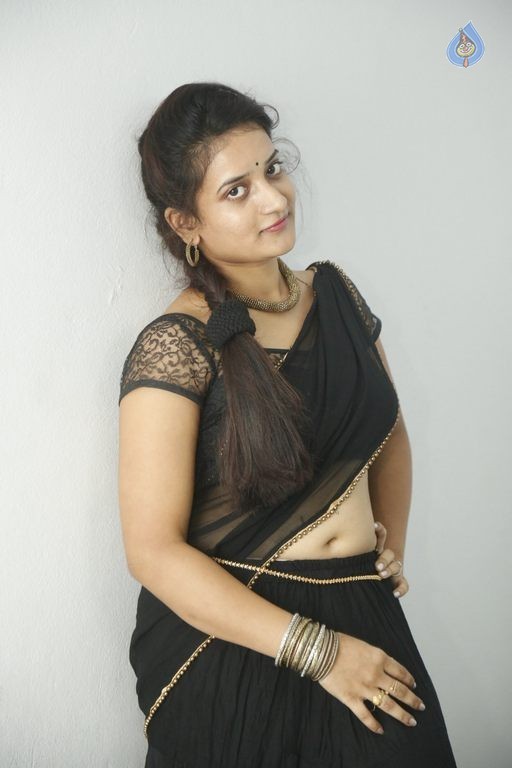 Actress Janani Reddy Hot Sexy Navel Show In Black Transparent Saree Photoshoot Stills 0H