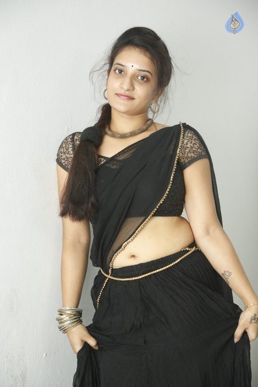 Actress Janani Reddy Hot Sexy Navel Show In Black Transparent Saree Photoshoot Stills 21