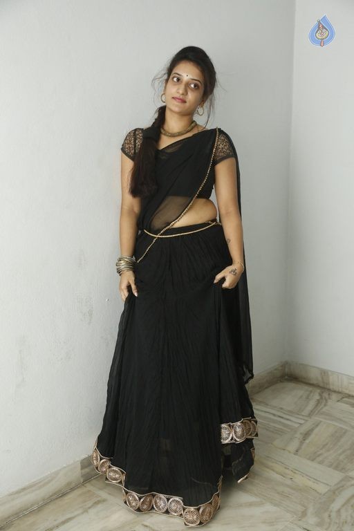 Actress Janani Reddy Hot Sexy Navel Show In Black Transparent Saree Photoshoot Stills 59